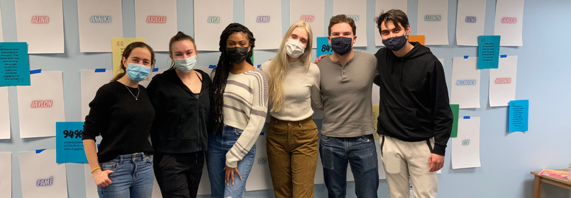 Group of six former peer educators wearing face masks
